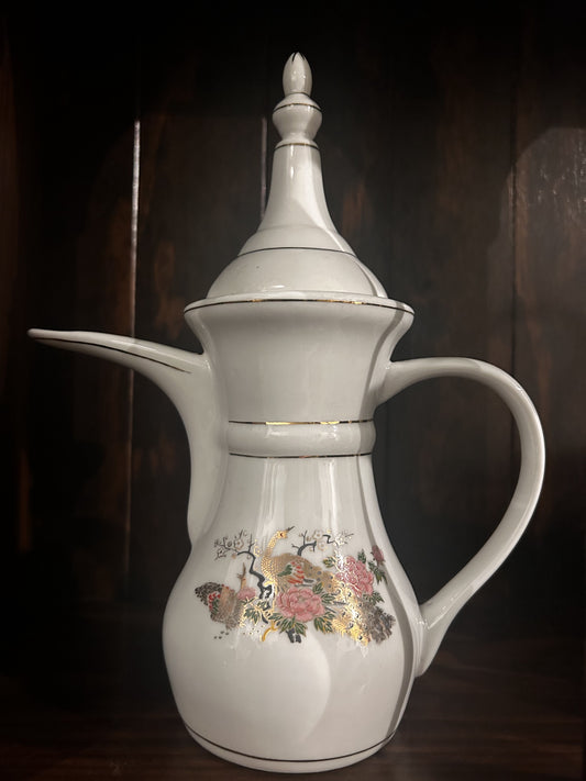 White tea pot with peacock